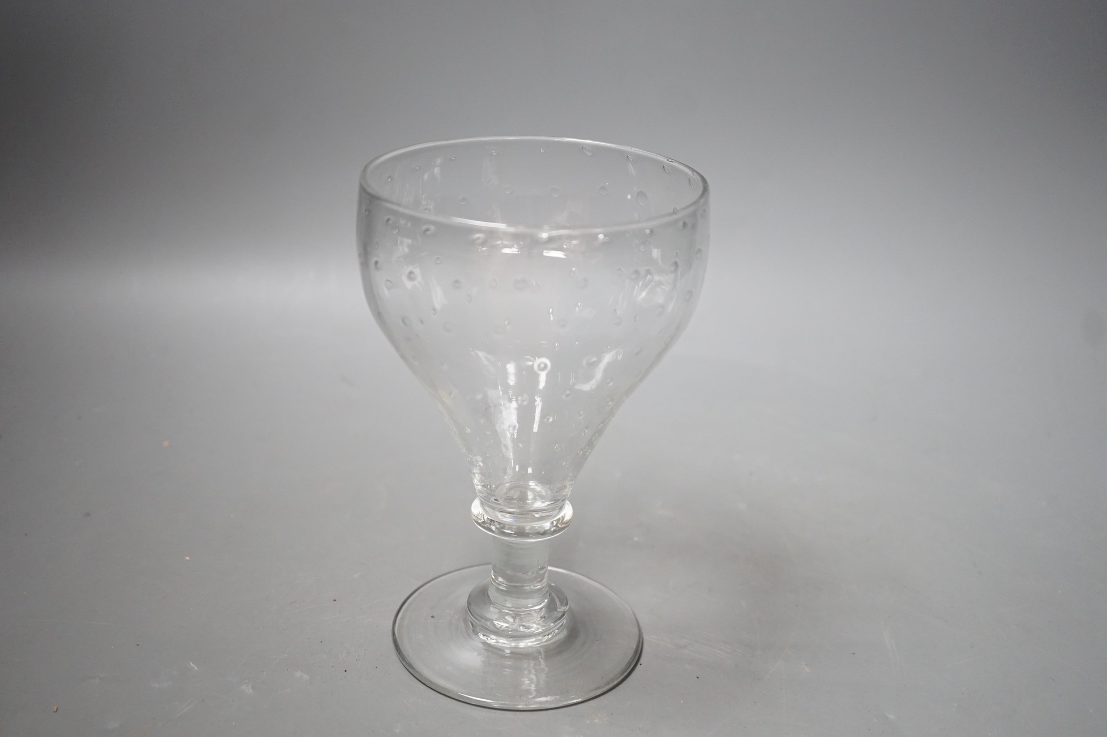 A unusual glass rummer, with a pattern of bubble inclusions to the bowl. 16cm high